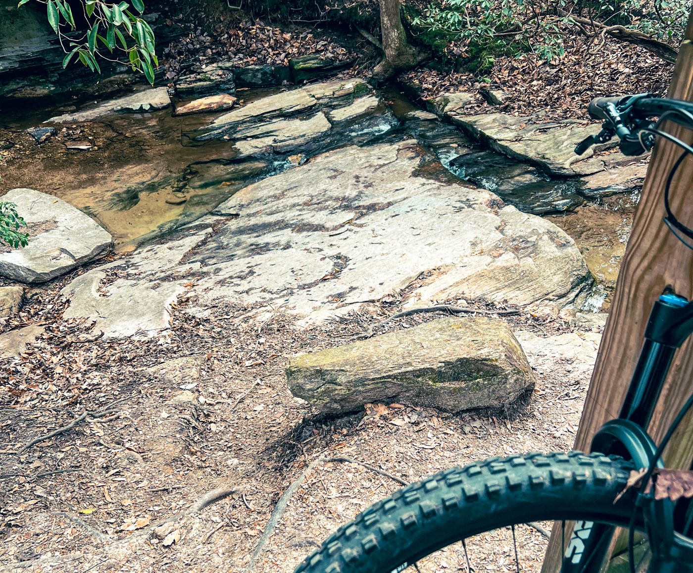 A mountain bike beside a rocky creek crossing in North Georgia